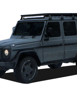 This 2166mm/85.3'' long full-size Slimline II cargo carrying roof rack kit for the Mercedes Gelandewagen G Class contains Slimline II Tray and Wind Deflector, as well as 8 Gutter Mount legs for mounting the Tray to the vehicle. It installs easily with no drilling required.