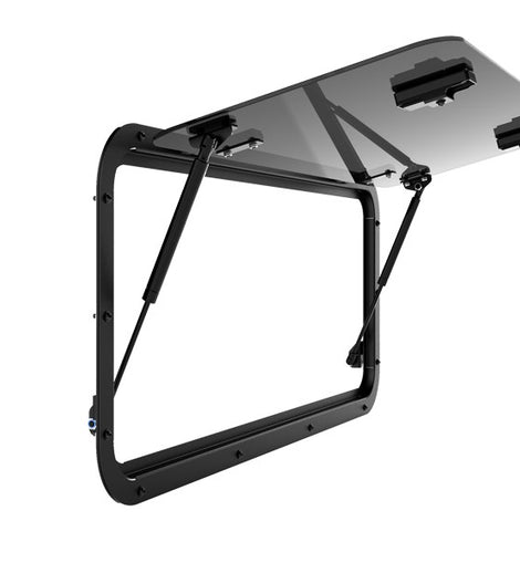 The Front Runner Glass Gullwing Window for the Defender ​replaces the rear window of a Defender and allows you to tilt up the window, creating 100% easy access to the contents of your load area.   