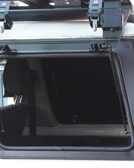 ​The Front Runner Glass Gullwing Window replaces the stock LEFT HAND rear window with an upward/outward opening window that is hinged at the top. Create easy access to the rear storage area of your Toyota Land Cruiser 76. 