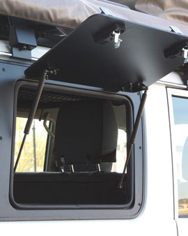 ​The Front Runner Aluminium Gullwing window replaces the stock RIGHT HAND rear window with an upward/outward opening window that is hinged at the top. Create easy access to the rear storage area of your Toyota Land Cruiser 76. 