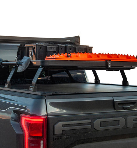 This kit creates a full-size rack that sits above your Ford F150 Raptor’s (2005 + w/Retrax XR rails) load bed. This Slimline II cargo carrying rack kit contains the Slimline II Tray (1475mm x 1358mm) and 6 Pickup Truck Bed Universal Legs that fit into the existing Retrax XR rails.
