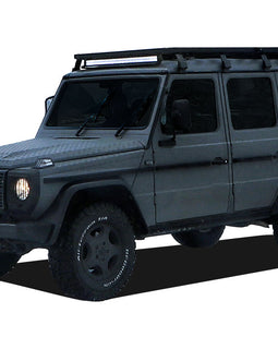 This 2166mm/85.3'' long full-size Slimline II cargo carrying roof rack kit for the Mercedes Gelandewagen G Class contains Slimline II Tray and Wind Deflector, as well as 8 Gutter Mount legs for mounting the Tray to the vehicle. It installs easily with no drilling required.