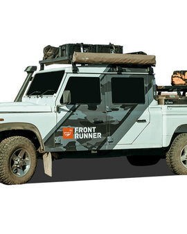 This 1560mm/61.4'' long 1/2 size Slimline II cargo carrying roof rack kit for the Land Rover Defender 110/130 contains Slimline II Tray and Wind Deflector, as well as 6 Gutter Mount legs for mounting the Tray to the vehicle. It installs easily with no drilling required.