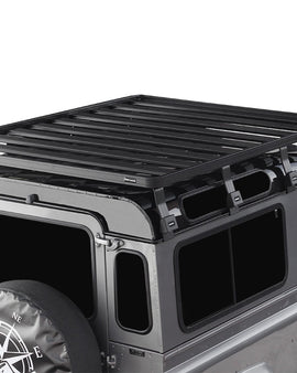 This 1964mm/77.3'' long full-size Slimline II cargo carrying roof rack kit for the Land Rover Defender 90 contains Slimline II Tray and Wind Deflector, as well as 8 Gutter Mount legs for mounting the Tray to the vehicle. This taller kit has space for mounting the Front Runner tables or other compatible accessories under the rack. It installs easily with no drilling required.