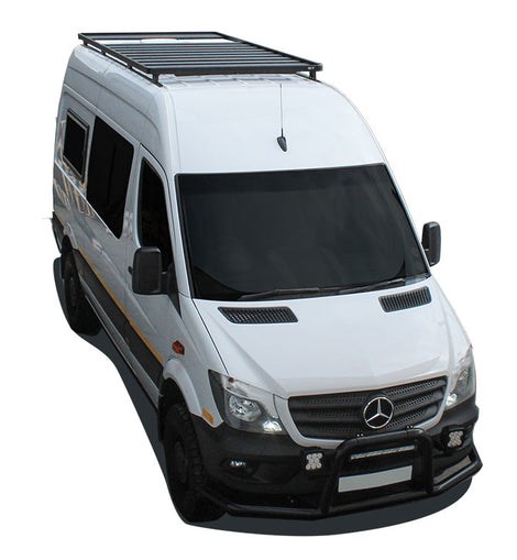 This 2772mm/109'' long full-size Slimline II cargo carrying roof rack kit for the Mercedes Benz Sprinter contains Slimline II Tray, Wind Deflector and 8 Feet. It installs easily to factory mounting points with no drilling required. Fits the ''Tall Roof'' option only. Will not fit the ''Standard/Low Roof''.