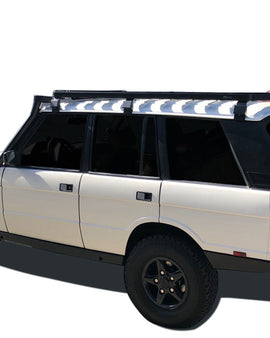 This 1964mm/77.3'' long full-size Slimline II cargo carrying roof rack kit for Range Rover (1970-1996) contains Slimline II Tray and Wind Deflector, as well as 6 Gutter Mount legs for mounting the Tray to the vehicle. This taller kit has space for mounting the Front Runner tables or other compatible accessories under the rack. It installs easily with no drilling required. 