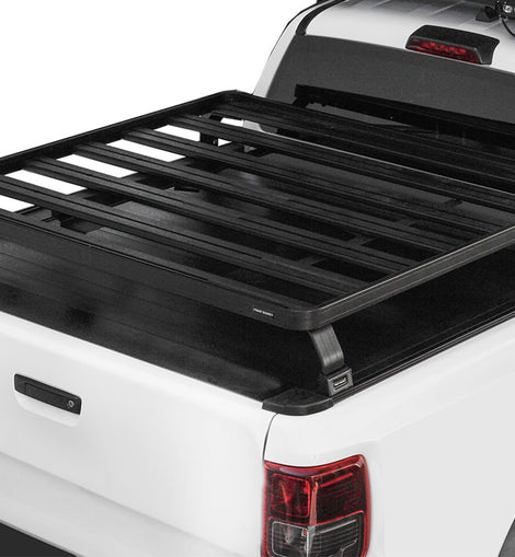 This kit creates a full-size rack that sits above your Pickup Truck's load bed when fitted with a Roll Top Cover. This Slimline II cargo carrying rack kit contains the Slimline II tray (1425mm x 1156mm) and 4 Pickup Roll Top Leg Mounts that fit into the existing factory/OEM tracks in your Roll Top Cover.