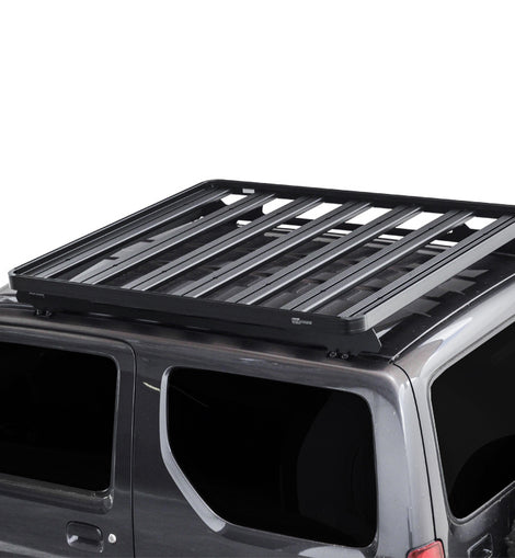 This 1358mm/53.5'' long full-size Slimline II cargo roof rack kit contains the Slimline II Tray, Wind Deflector and 2 Foot Rails to mount the Slimline II Tray to your Suzuki Jimny. It easily installs using the existing factory mounting points. No drilling required.