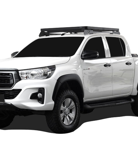 This 1358mm/53.5'' long full-size Slimline II cargo roof rack kit contains the Slimline II Tray, Wind Deflector and 2 Foot Rails to mount the Slimline II Tray to your Toyota Hilux Revo Double Cab. Drilling into the vehicles roof is required to insert mounting hardware, a template is provided for hole placement. 