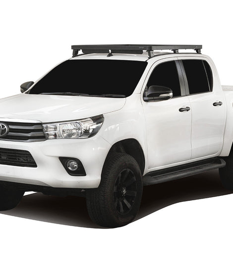 This 1358mm/53.5'' long, full-size, Slimline II cargo carrying roof rack kit for the Toyota Hilux Revo contains the Slimline II Tray, Wind Deflector, 2 Tracks and 6 Feet. Drilling is required for installation.