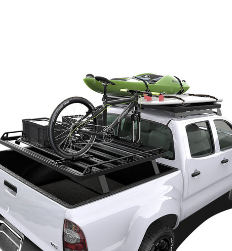 This kit creates a full size rack that sits above your Toyota Tacomas (2005 + w/OEM bed rails) load bed. This Slimline II cargo carrying rack kit contains the Slimline II tray (1425mm/56.1'' (W) x 1358mm/53.5'' (L)) and 4 Pickup Truck Bed Universal Legs that fit into the existing factory/OEM bed tracks. No drilling required. 
