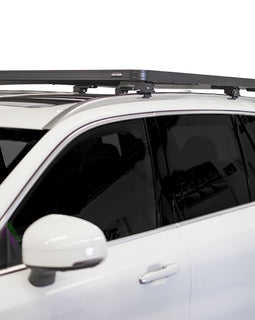This 1358mm/53.5 long, full-size, Slimline II cargo roof rack kit contains the Slimline II Tray, Wind Deflector and 3 pairs of Rail Grip Feet to mount the Slimline II Tray to the roof rails of your Volvo XC90. This system installs easily with off-road tough feet that grip onto the existing factory/OEM roof rails. No drilling required.